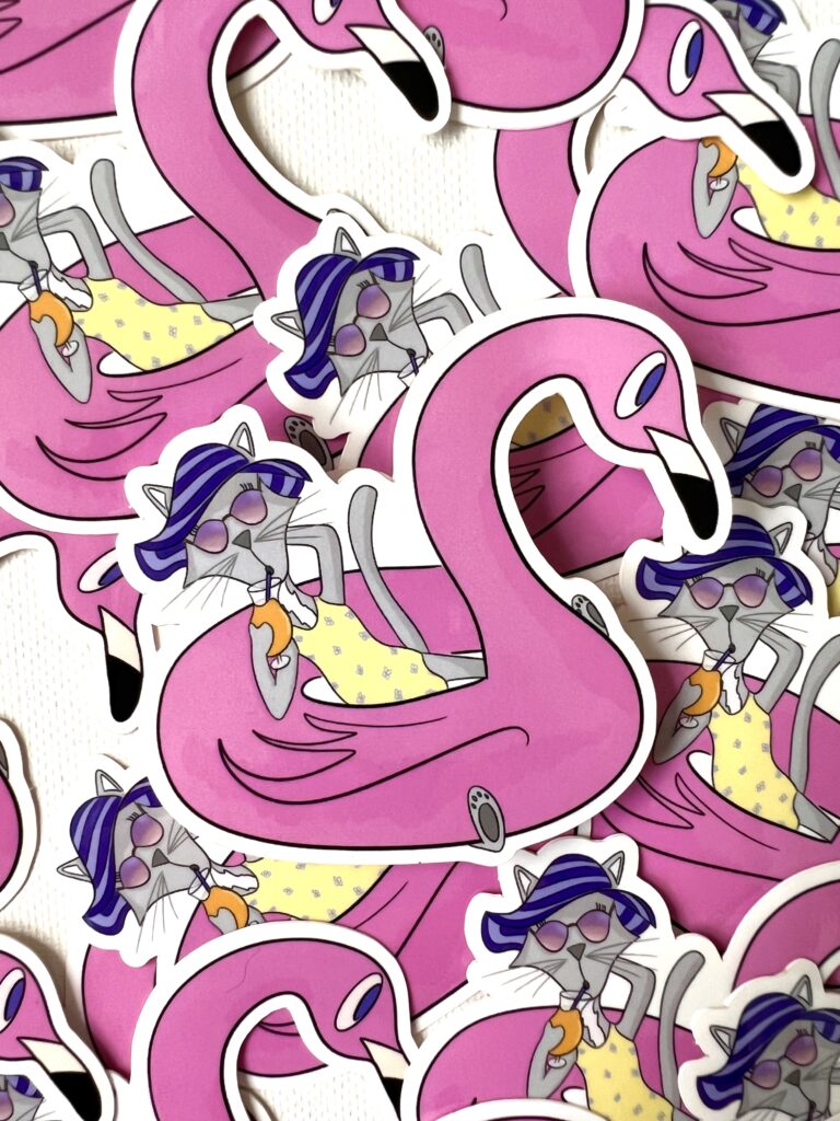 Stickers showing a cat lounging on a flamingo float while wearing a sun hat and sun glasses and drinking a tropical cocktail